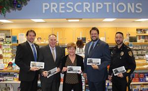 Butler Pharmacy in Point Pleasant is one of many pharmacies in Ocean County sharing opioid safety and awareness messages on bags created by the Partnership for a Drug-Free New Jersey (PDFNJ) and distributed by the Ocean County Prosecutor’s Office
(OCPO). From left: OCPO Agent Michael Colwell, PDFNJ Executive Director Angelo Valente,
Butler Pharmacy owner Tracye Steel, Ocean County Prosecutor Bradley Billhimer, and Point
Pleasant Borough Police Chief Adam Picca