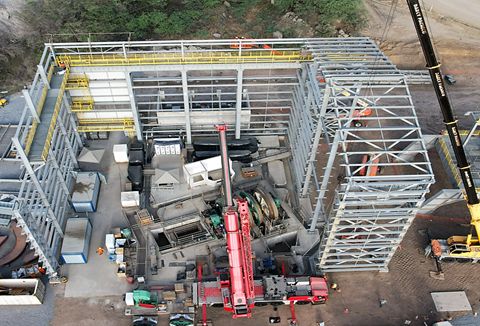 Construction and assembly of the personnel and material winder building as of July 2023 (right).