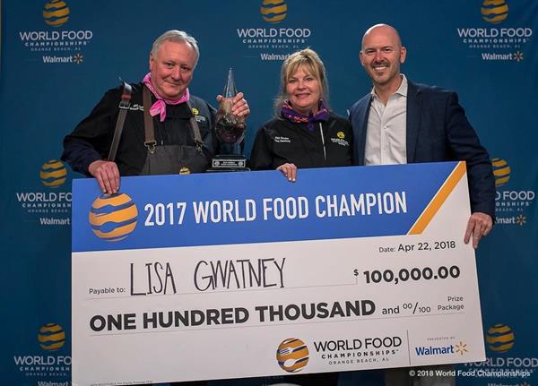 2017 World Food Champion, Lisa Gwatney (middle), accepting her prize check from Mike McCloud (right), CEO and President. 