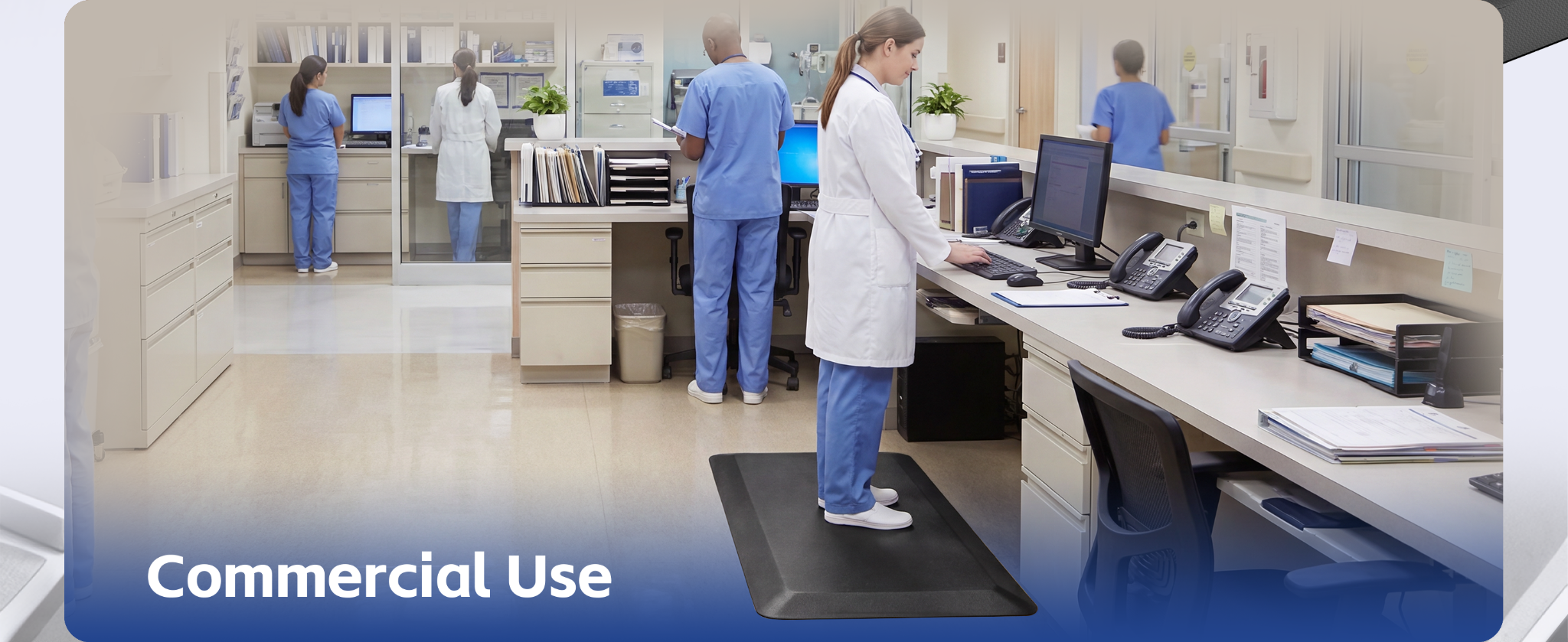 Healthcare worker using a FEATOL anti fatigue mat at a workstation during prolonged standing.
