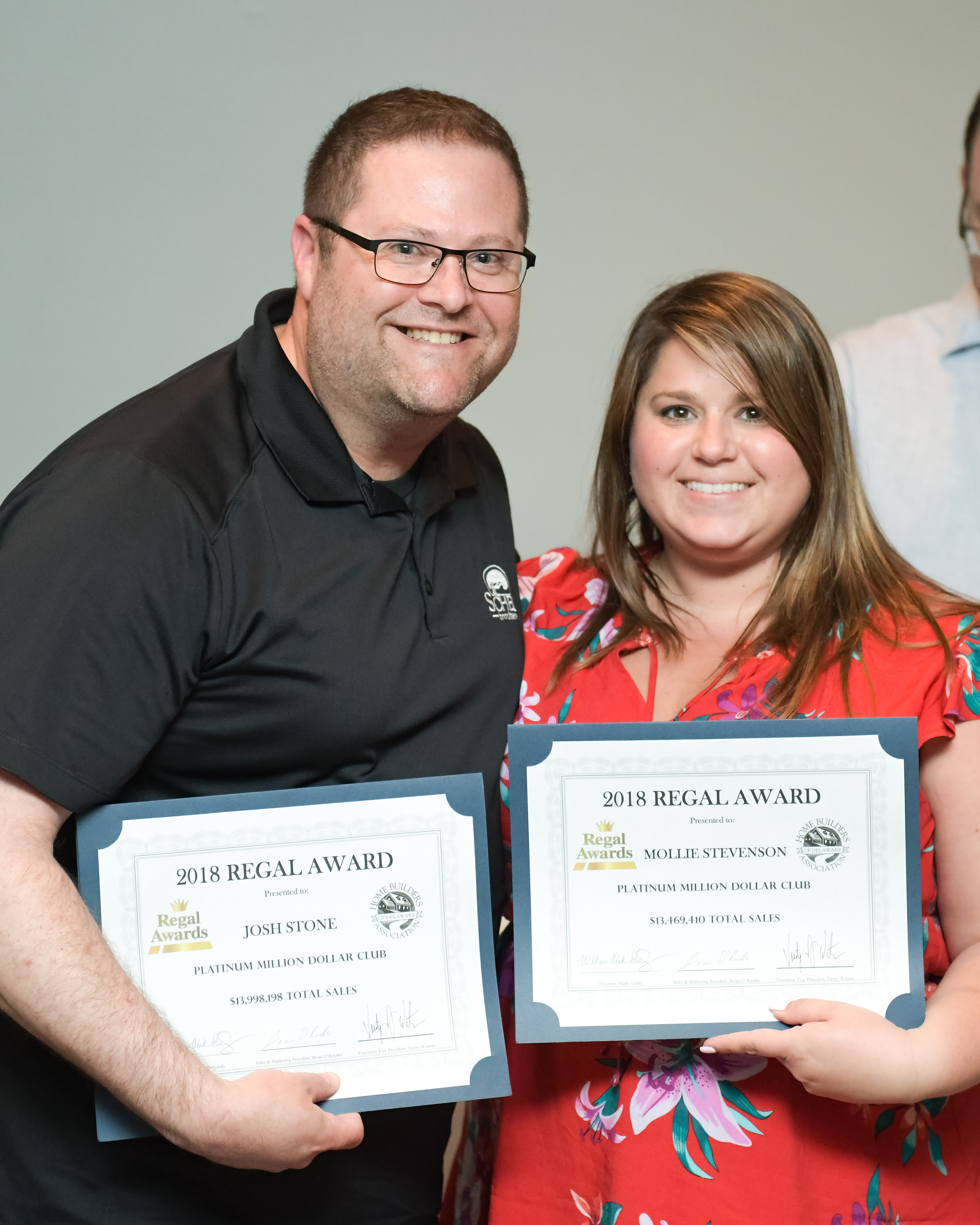 Josh Stone and Mollie Stevenson, Community Sales Managers at Independence, show off their Regal Awards for the Platinum Million Dollar Club.