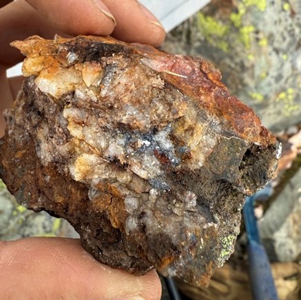 Figure 3: Float sample G018664, collected from historic Adit waste pile. Sample consisted of quartz veins in strongly sheared mafic tuff, with pyrite and minor chalcopyrite mineralization. The sample assayed 1.96 g/t Au, 28.40 g/t Ag, and 1.15% Pb.