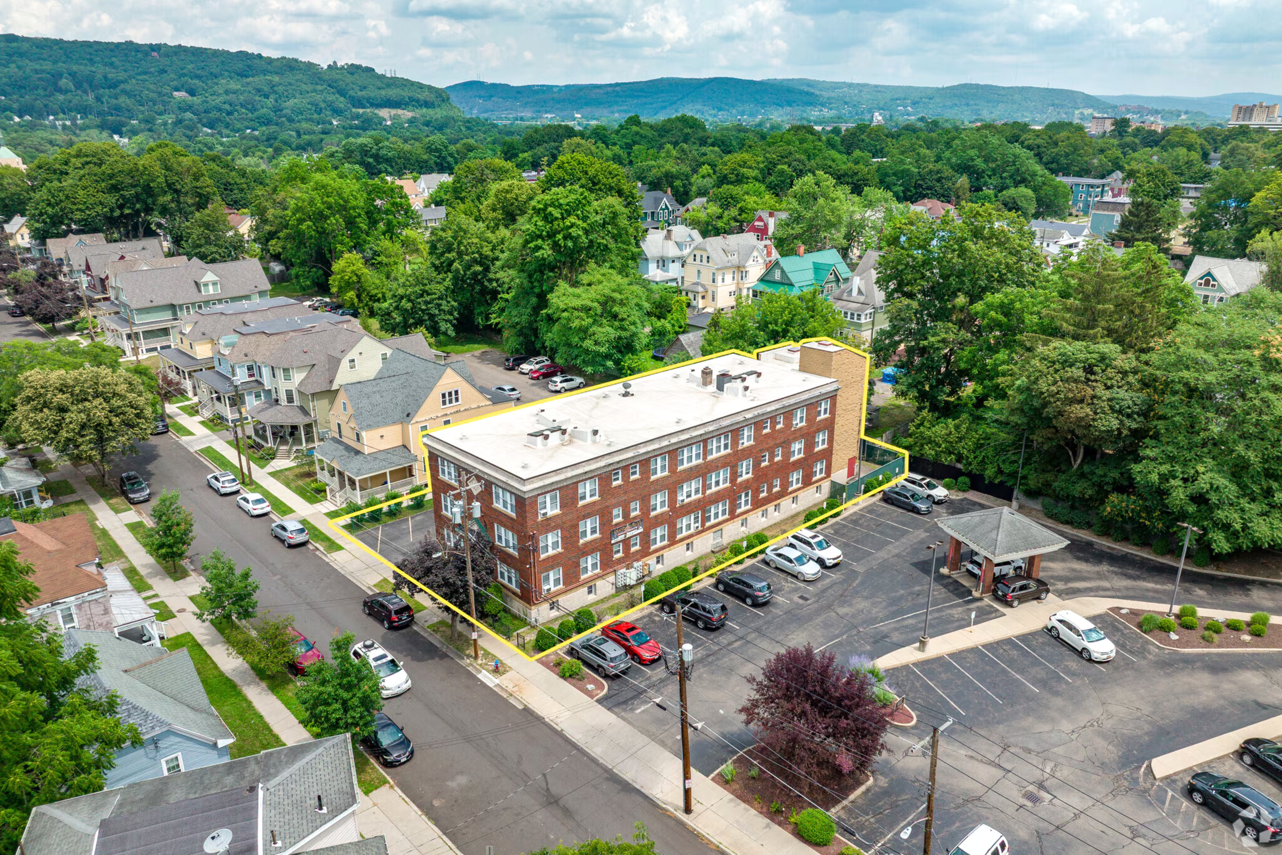 Binghamton NY multifamily investment – renovated 24-unit apartment building at 2 Crandall Street, for sale via Ten-X auction.