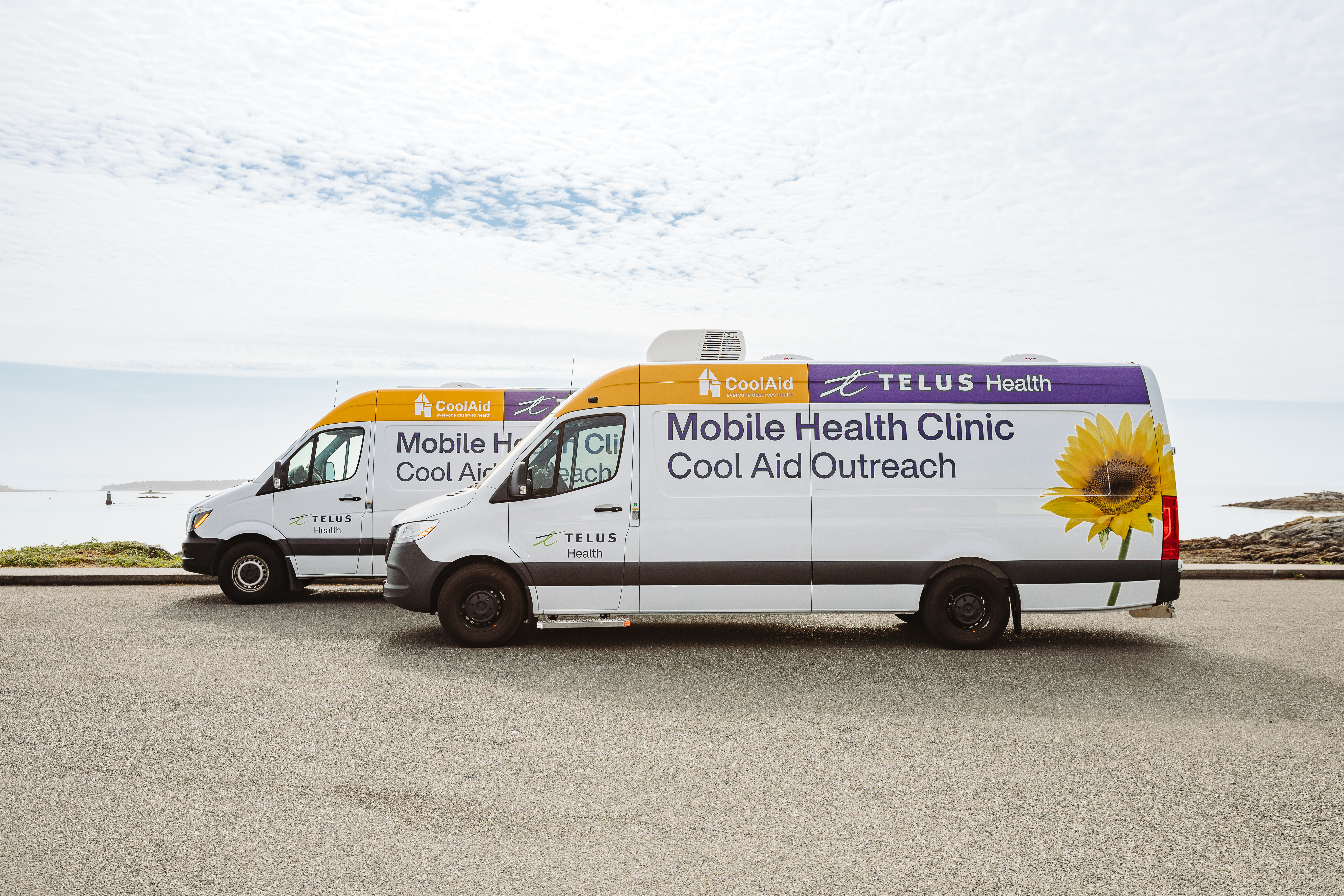 The two Cool Aid Mobile Health Clinics, powered by TELUS Health, pictured side by side. 