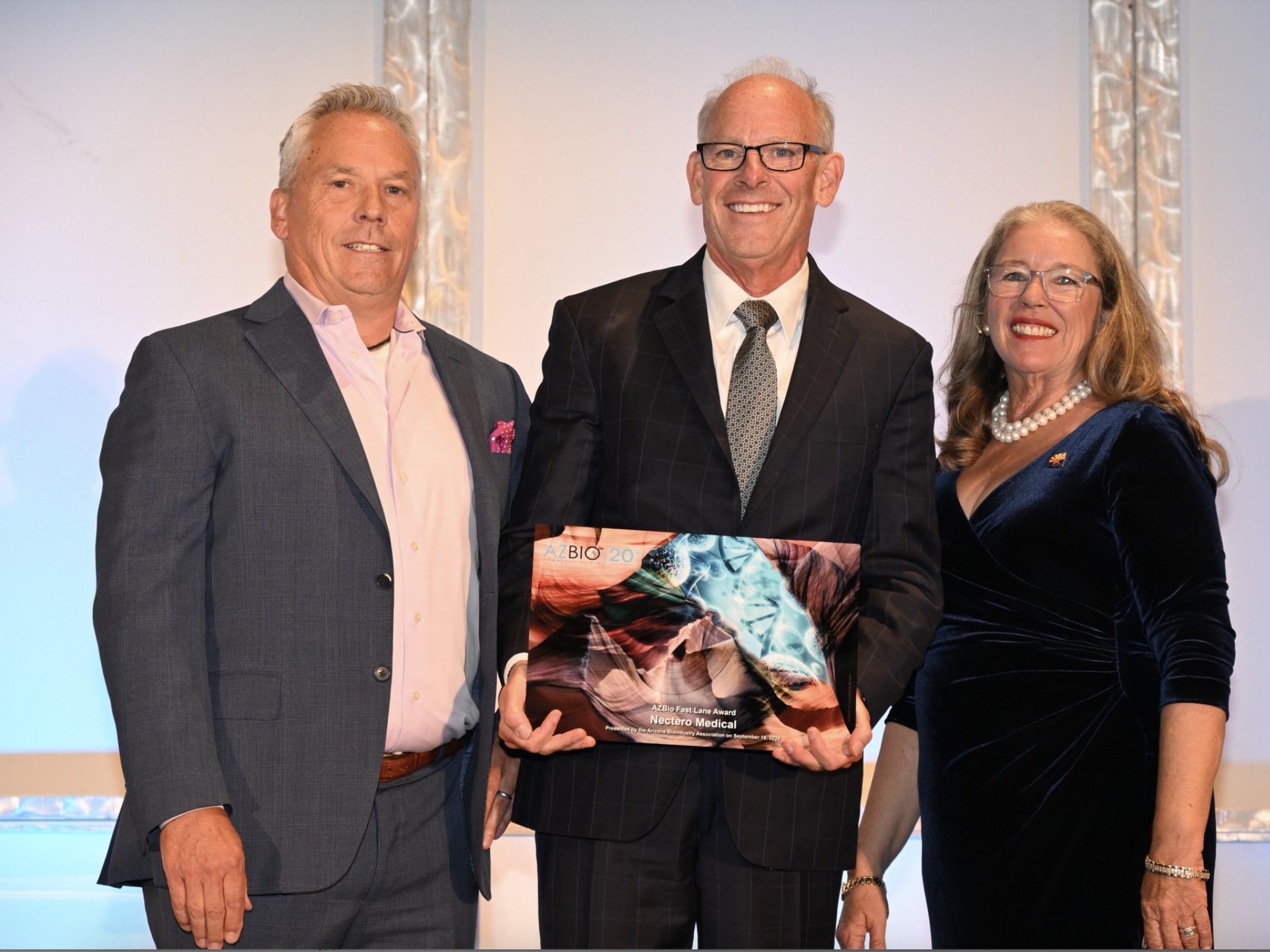 Jack Springer, President and CEO of Nectero Medical (center) accepts the 2024 AZBio™ Fast Lane Award from the Arizona Bioindustry Association (AZBio).