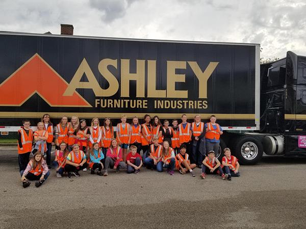 Students from Gale-Ettrick-Trempealeau Middle School (Wisconsin) pose in front of an Ashley semi after touring it.
