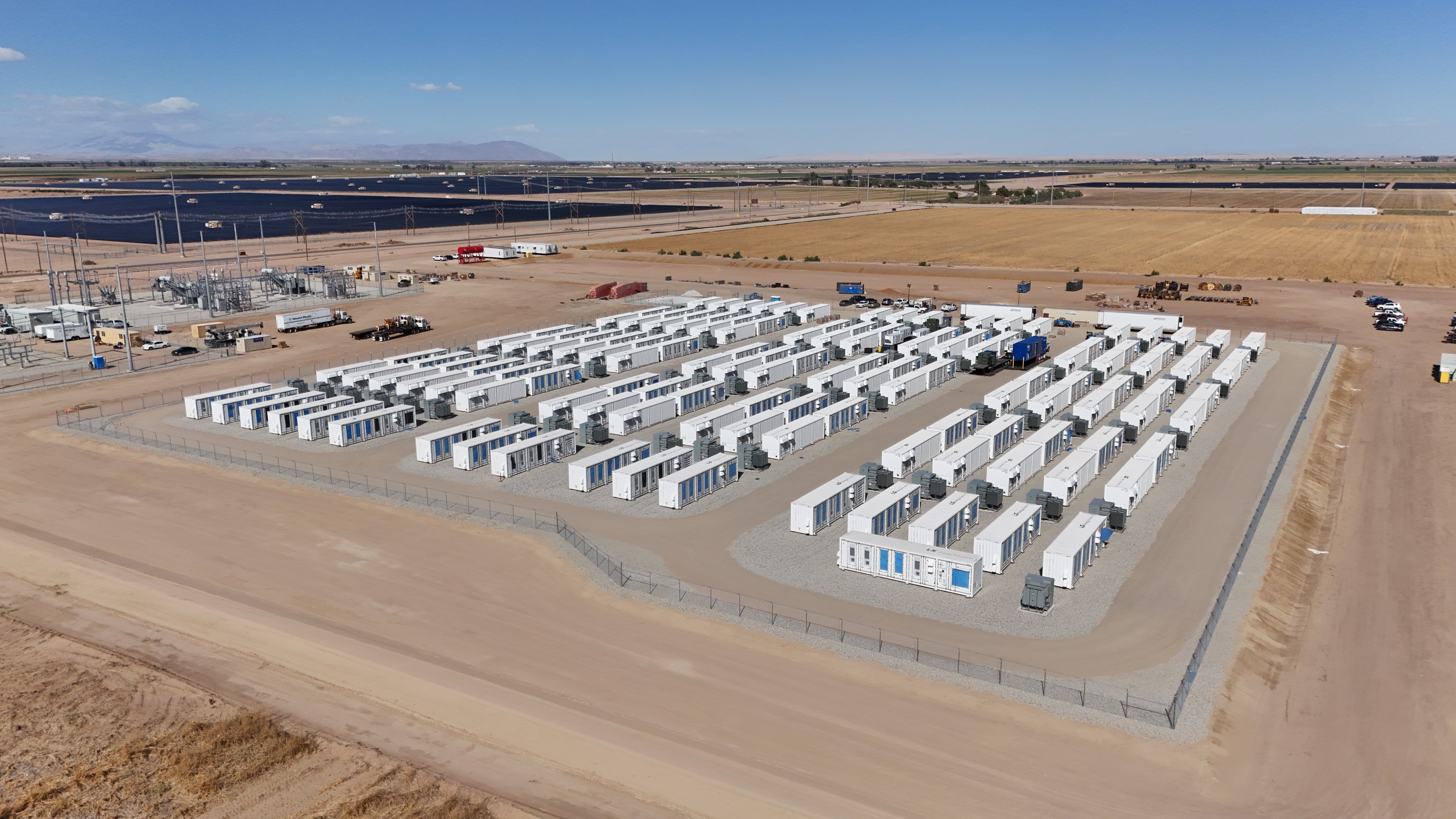 An overhead view of 137 LS-ES energy storage containers in a desert setting