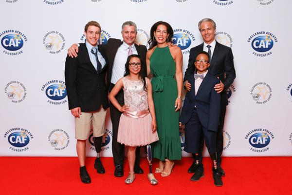 The 16th Annual Heroes, Heart and Hope Gala celebrates the transformational power of sports within the community. CAF Gala Chairman and Founder, Scott Stackman (far right) with Gala Committee Members Justin Model and Sari Levy-Schorr and CAF athletes David, Kaela, & Logan