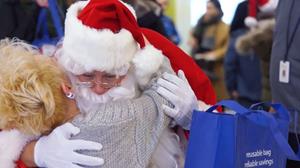 Santa and his elves deliver gifts to Operation Friendship Seniors Society in Edmonton, Alberta.