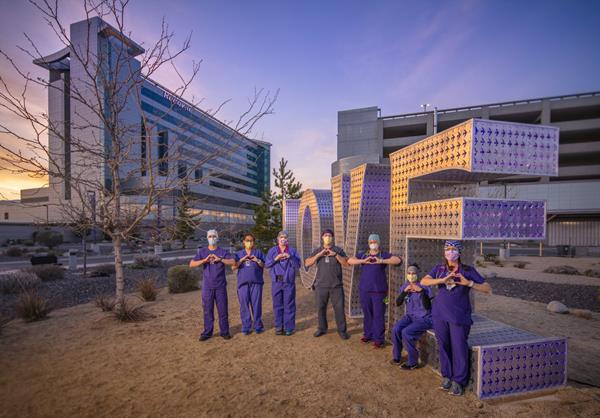 Renown Health nurses stand in front of Kimpton’s LOVE sculpture. (Photo: David Siegel)