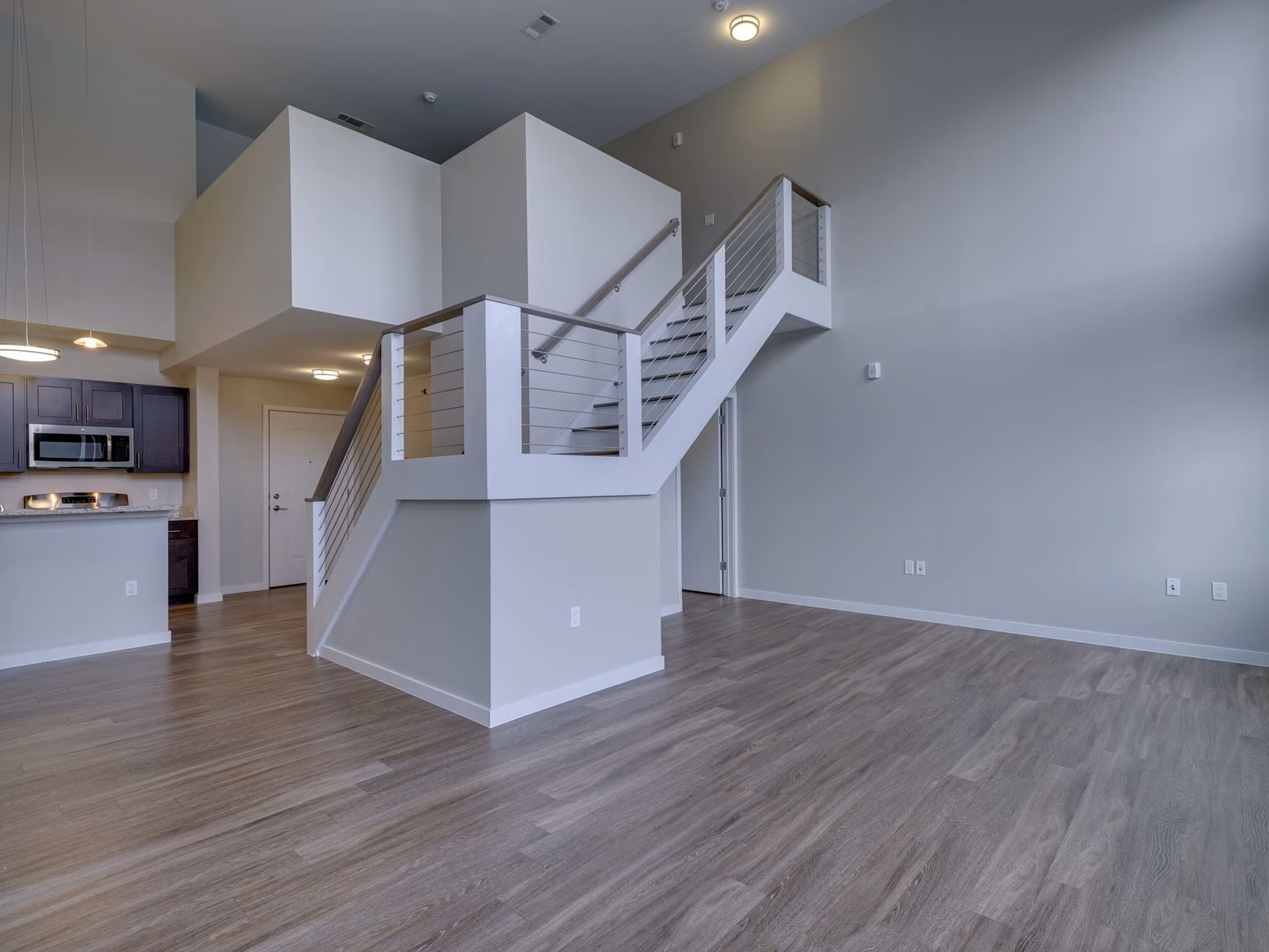 Loft-style apartment interior at College & Crown featuring open layout and modern finishes.