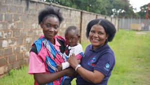 A community case worker supports a young mother and her baby