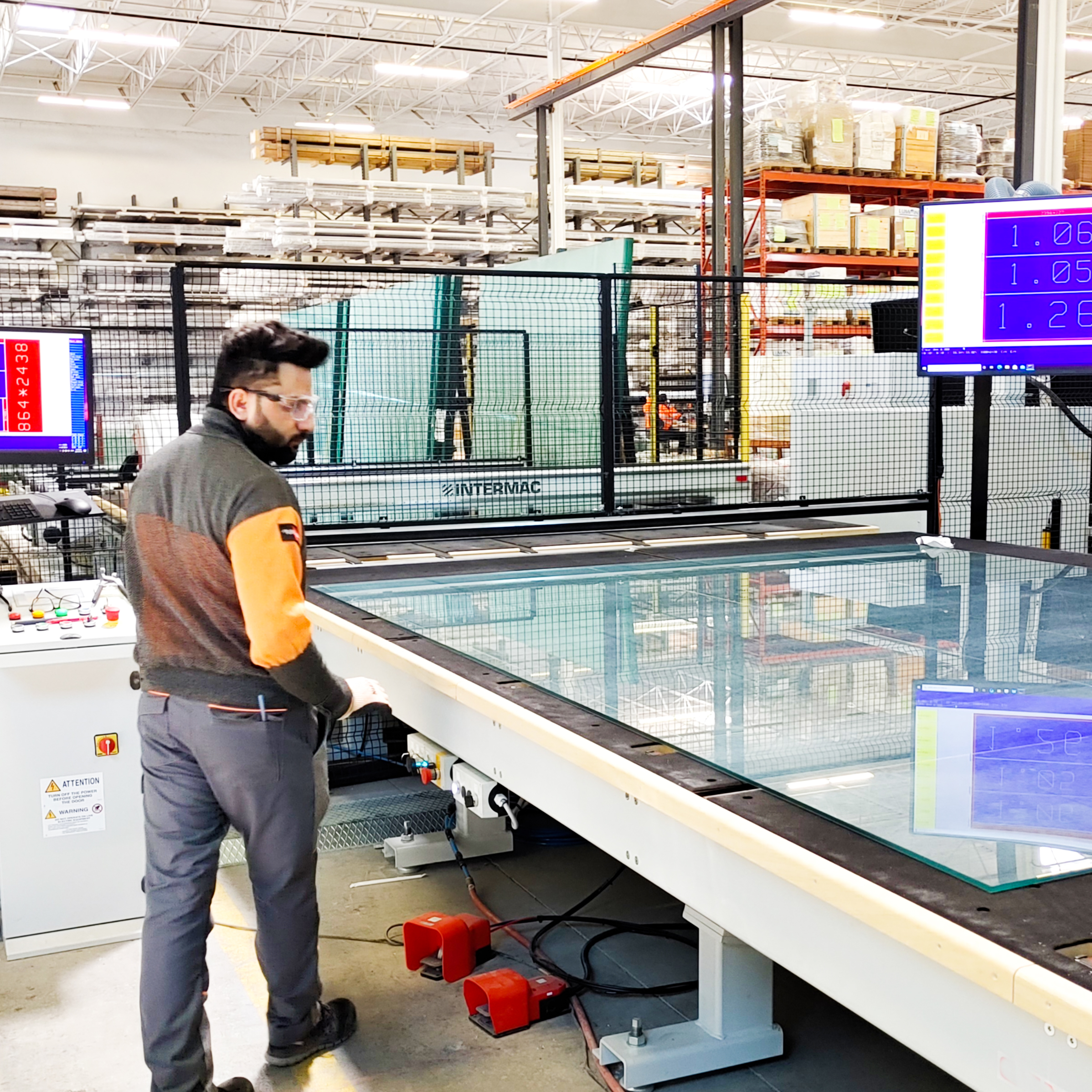 Employee glass cutting with high-end machinery
