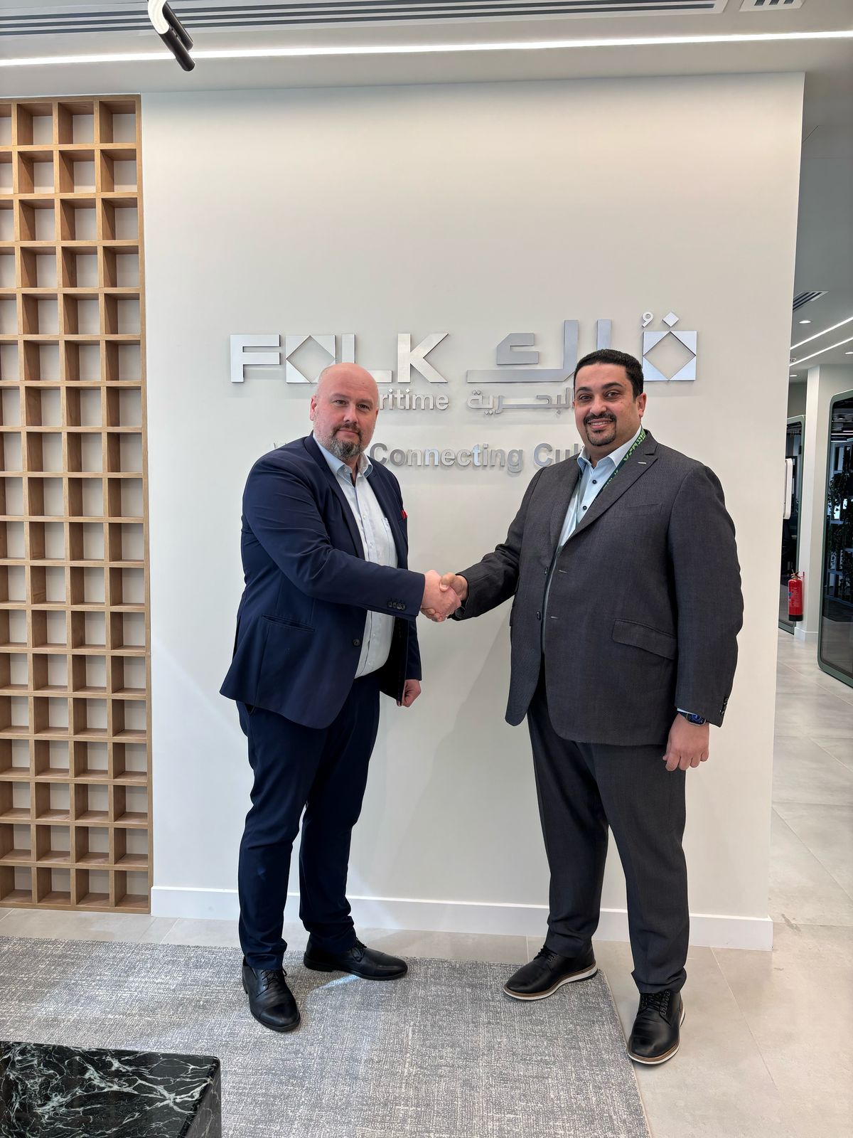 Richard Jacobsen, Sales Director EMEA Maritime at ORBCOMM (left), and Mohamed Badawi, Chief Operating Officer of Folk Maritime (right), shake hands on a groundbreaking partnership. Folk Maritime will be the first from the Middle East to deploy ORBCOMM's smart container technology. This game-changing move transforms supply chain visibility and cargo security, setting a new standard for the region's maritime industry.