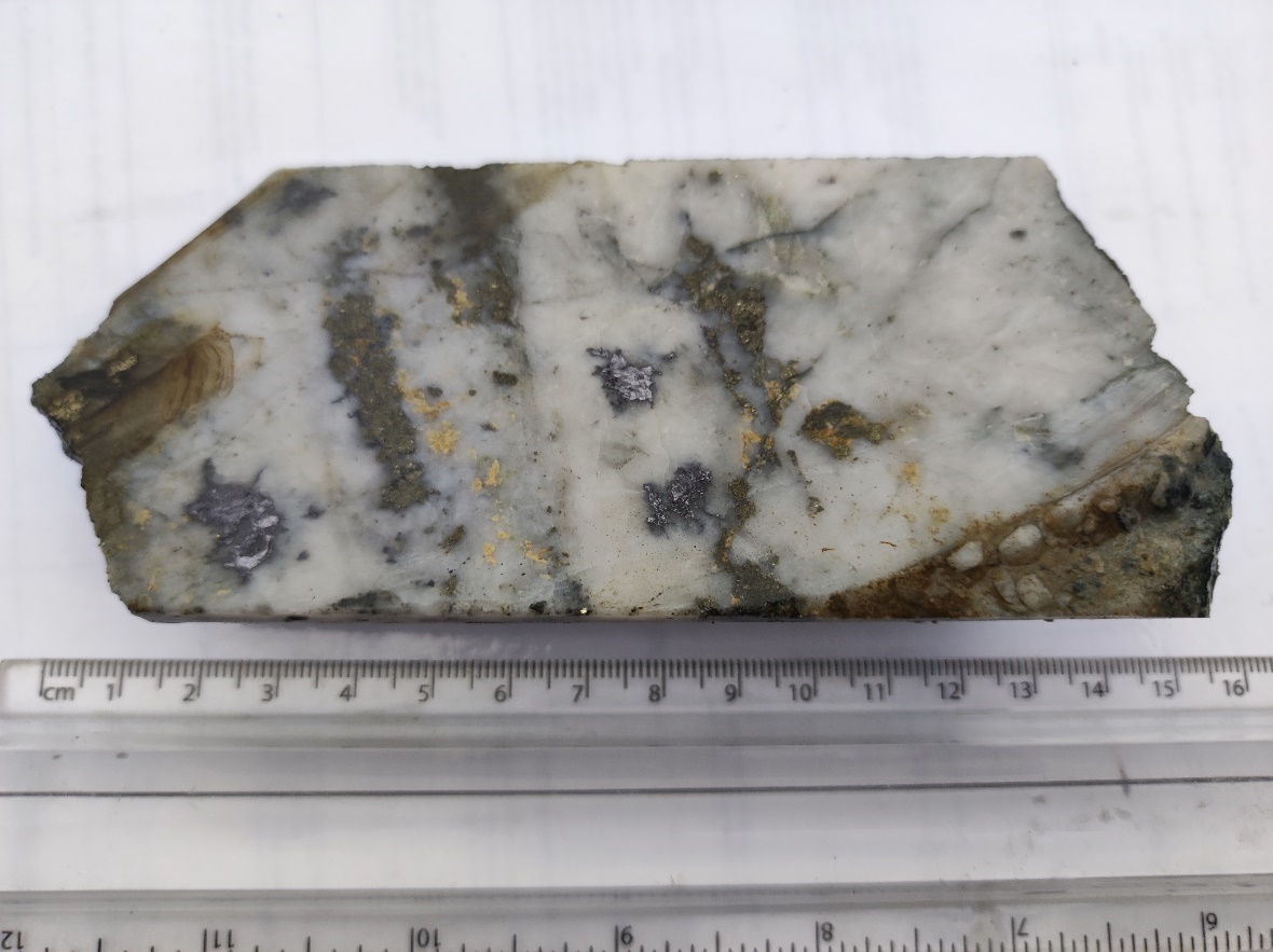 Part of a split section of drill core from a deeper intersection on hole FR-DD-22-UG-192 grading 75.2 g/t Au and 72 g/t Ag over a core length of 0.21 