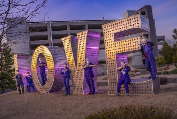 Renown Health nurses stand in front of Kimpton’s LOVE sculpture. (Photo: David Siegel)