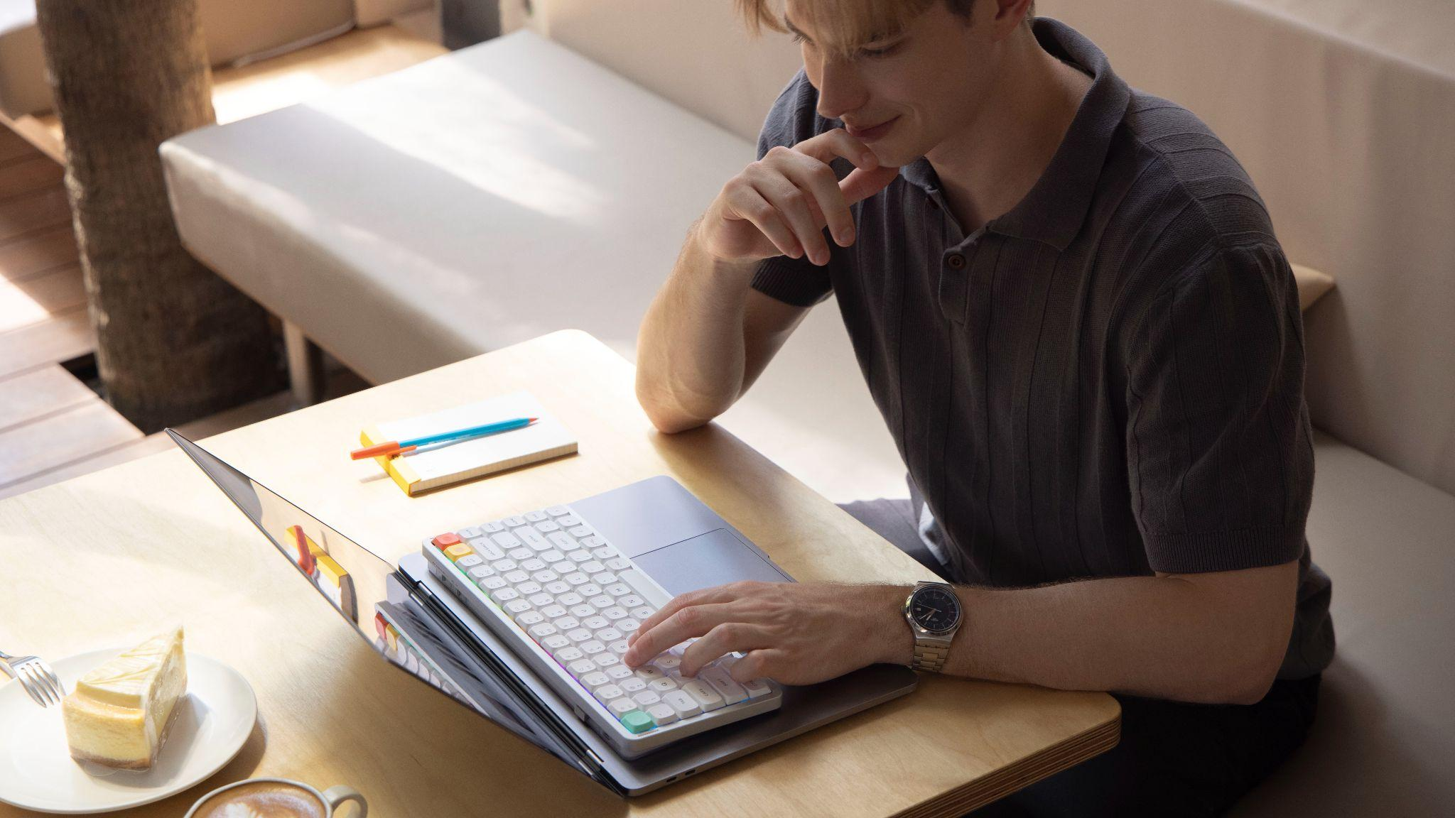 NuPhy Air V3 low-profile mechanical keyboard used with MacBook in a mobile workspace setup