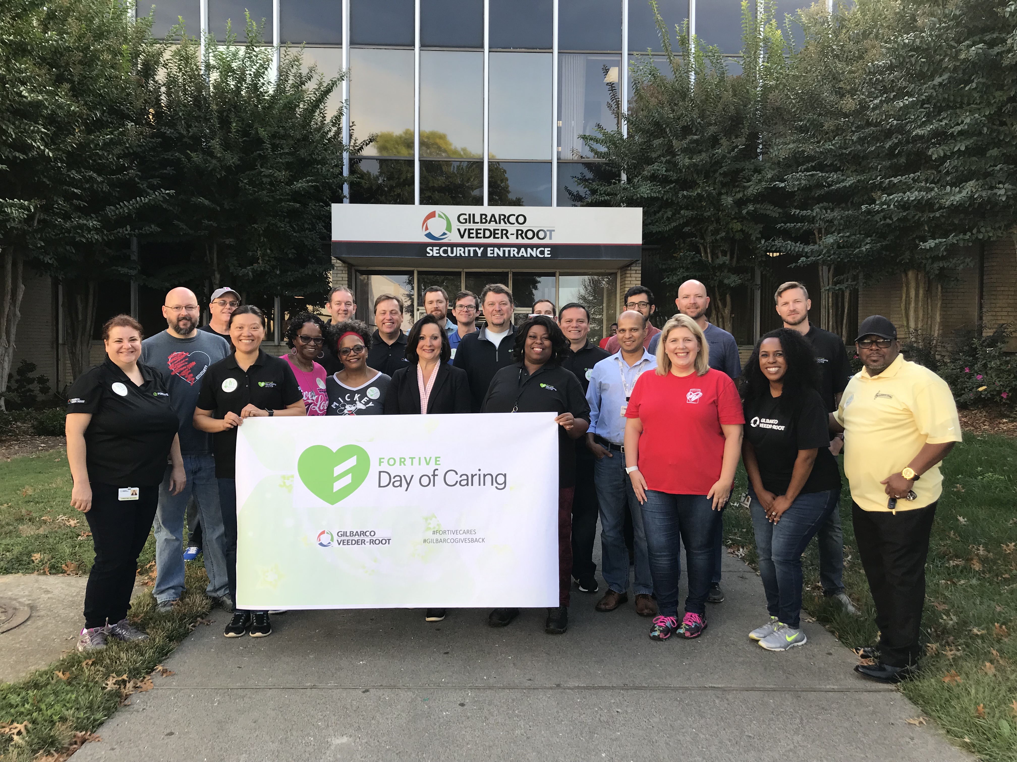 Mayor Nancy Vaughan (center) with Gilbarco Veeder-Root employees for Day of Caring