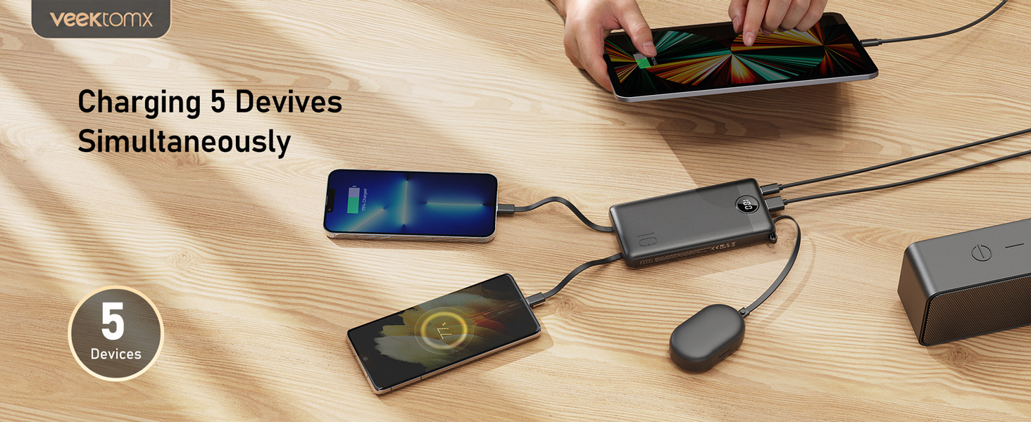 VEEKTOMX portable charger charging five devices simultaneously, showcasing multi-device compatibility and travel-friendly convenience.