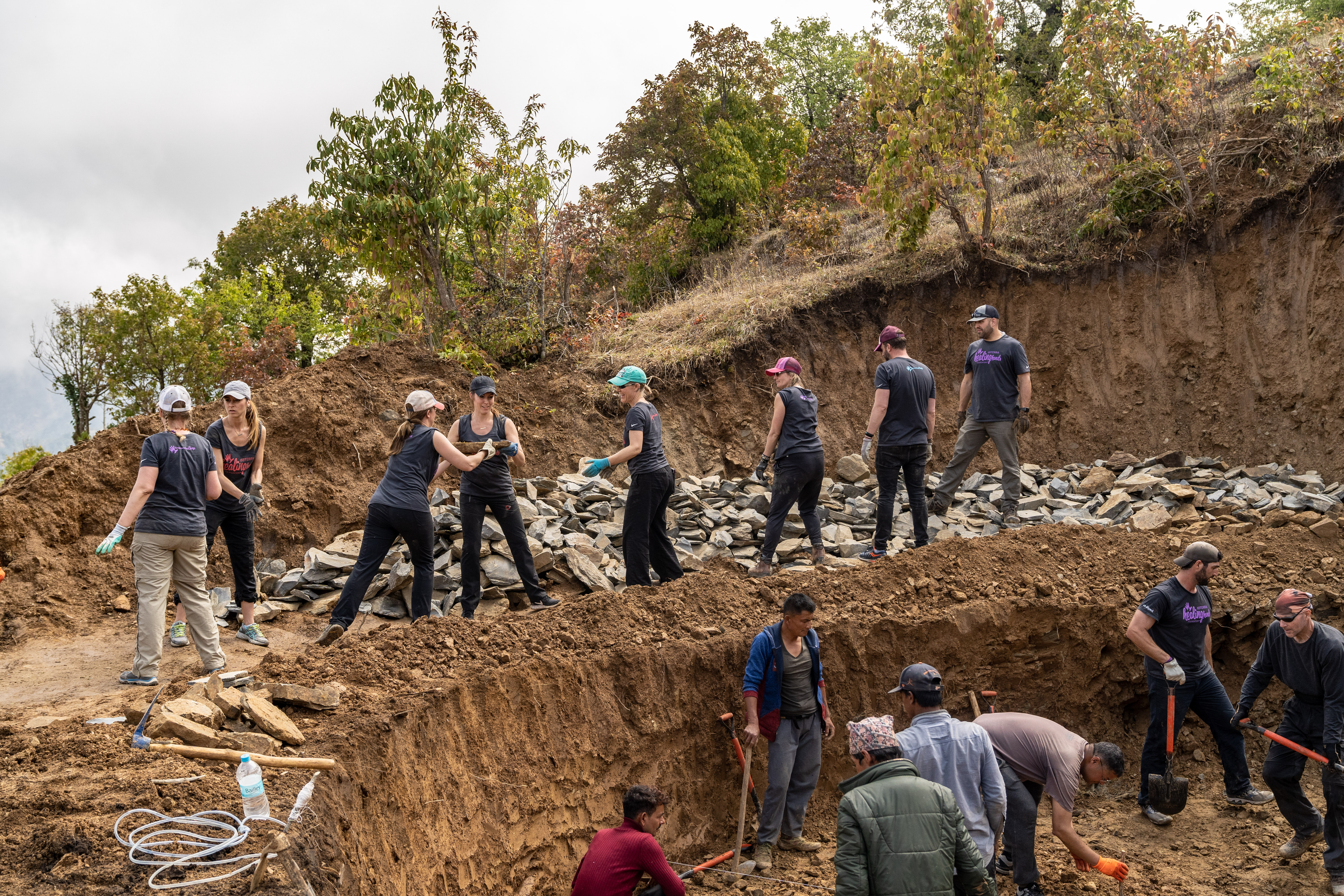 Residents of the Makawanpur District of Nepal work hand-in-hand with doTERRA Wellness Advocates on a water supply project that will serve approximately 2,500 people. 