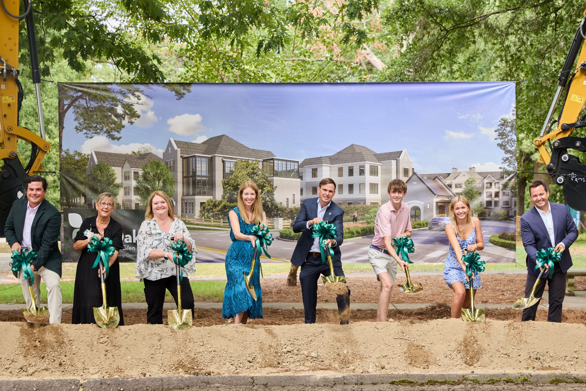 PruittHealth Chairman and CEO Neil L. Pruitt, Jr. (center), along with his family and others, celebrate at an event attended by local business leaders, community members, and future residents.