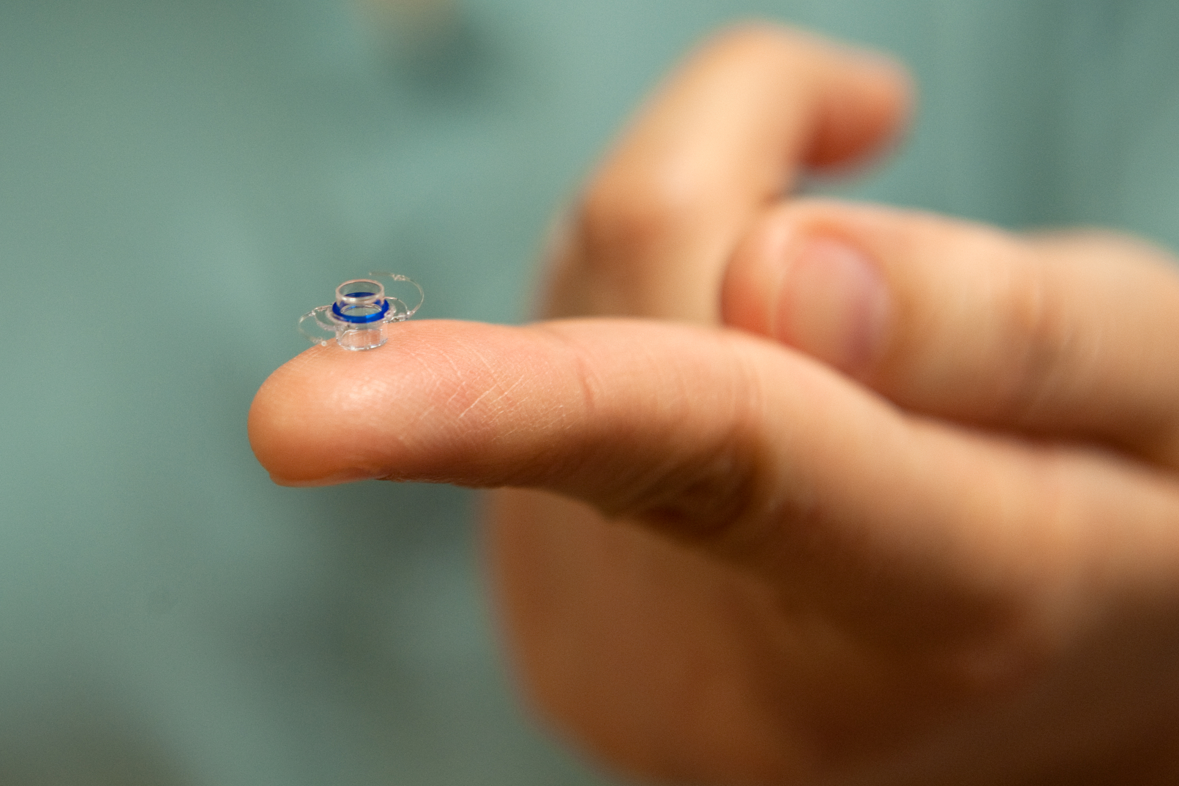 CentraSight Eye Telescope on Finger Photo Credit Steve Zylius, UC Irvine