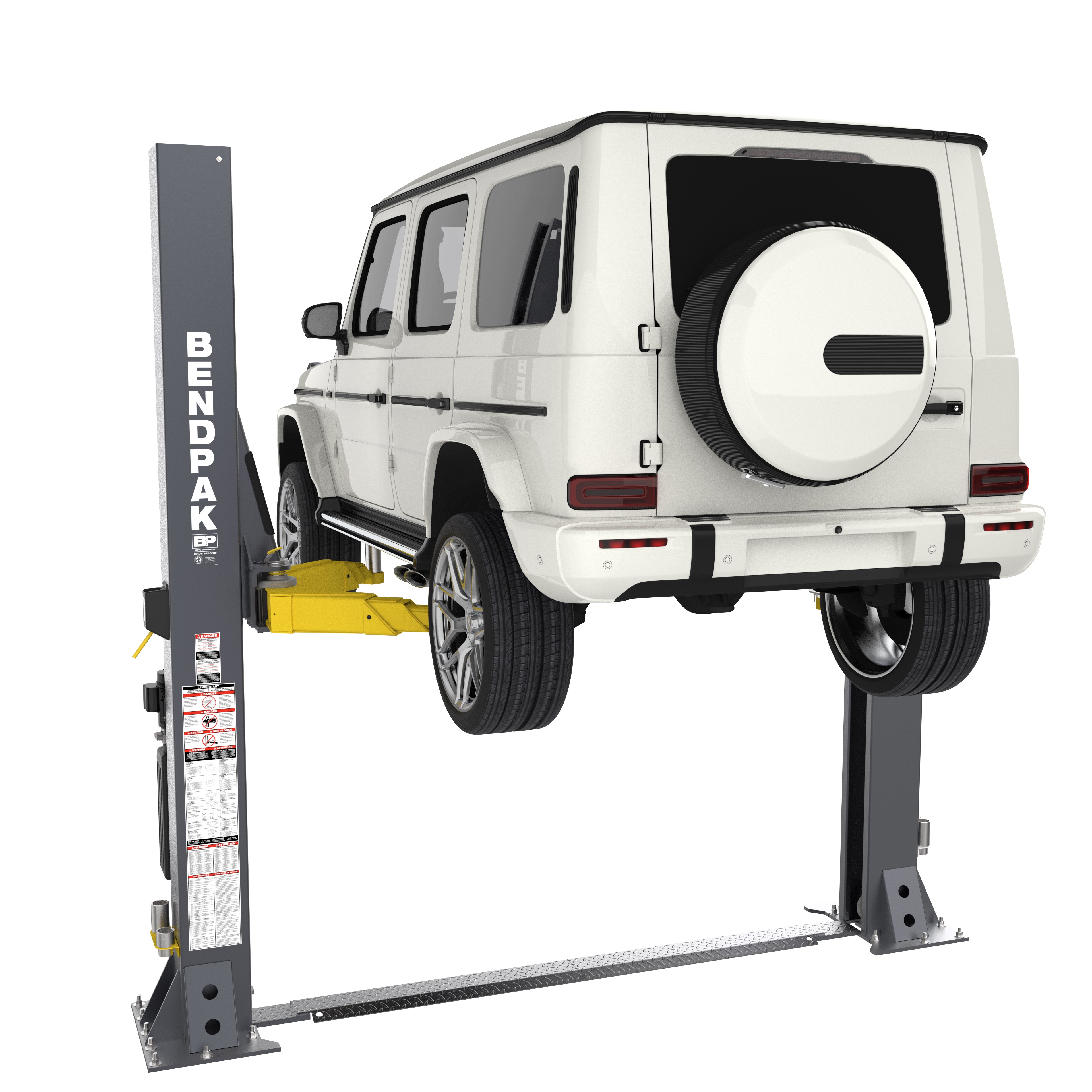 Rear view of a BendPak floorplate-style two-post car lift raising an SUV