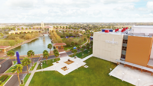 Palms Crossing, a 580,000 sq. ft. development by Washington Prime Group, is conveniently located steps away from the McAllen Convention Center district. Pictured here is the 1,800 seat McAllen Performing Arts Center, 2.4 acre Oval Park with reflective pool, and the 174,000 sq. ft. McAllen Convention Center.