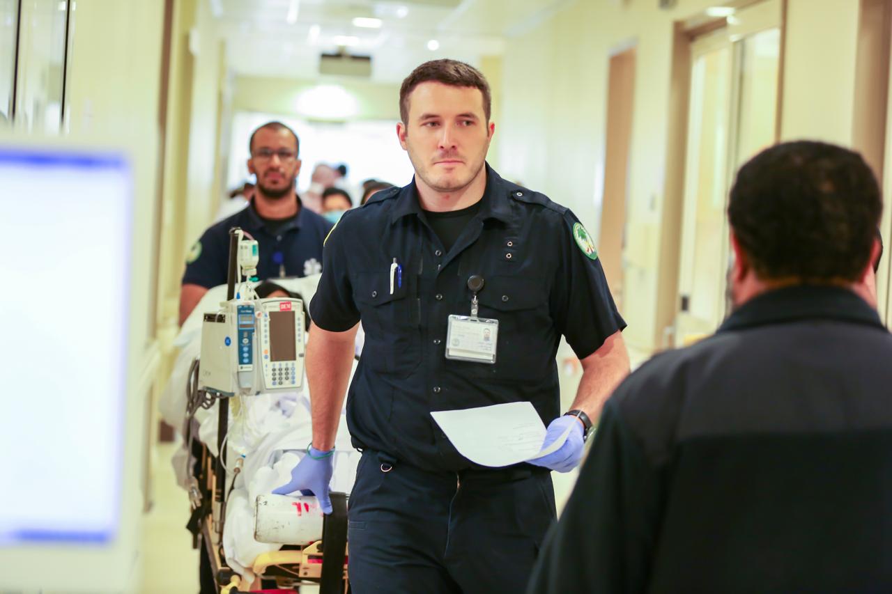 Emergency medical team at KFSHRC transporting a patient, reflecting improved emergency department efficiency and reduced inpatient bed waiting times