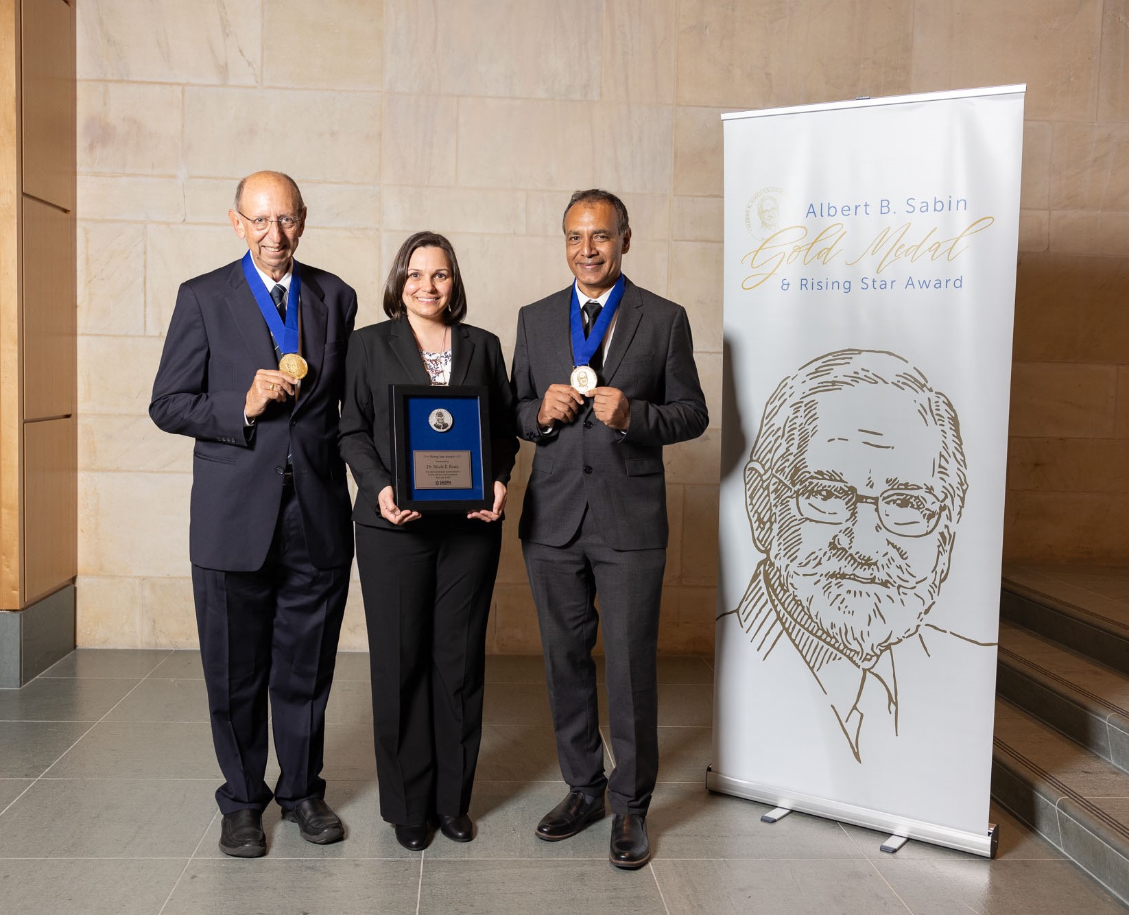 Dr. Keith Klugman (left) and Dr. Shabir Madhi (right) were presented the 2024 Albert B. Sabin Gold Medal and Prof. Nicole Basta (center) received the 2024 Sabin Rising Star Award from the Sabin Vaccine Institute at the National Academy of Sciences in Washington, D.C.