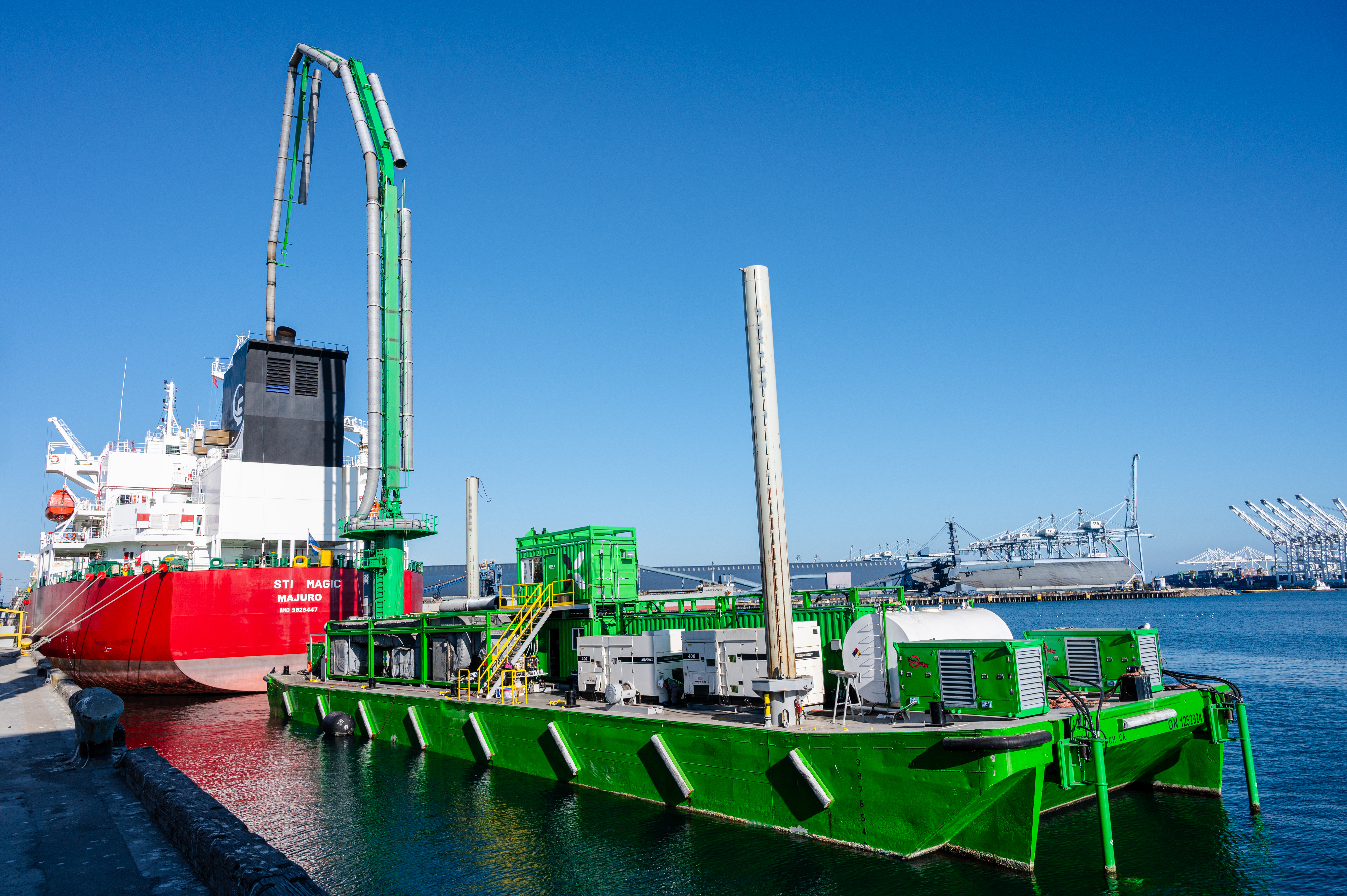A STAX treatment barge sits alongside a tanker at berth, part of the company’s growing fleet serving vessels across California ports.