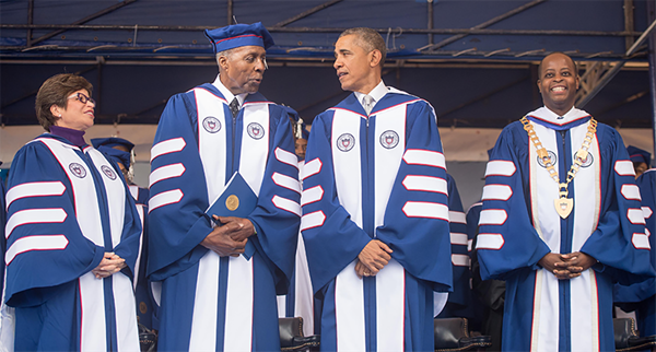 The Howard University Board of Trustees announces its unanimous decision, upon the recommendation of President Wayne A. I. Frederick, to name the Law School Library as the Vernon E. Jordan, Jr., Esq. Law Library in honor of the proud and devoted Howard alumnus, and Civil Rights icon. Pictured L to R: Valerie Jarrett, Jordan, President Barack Obama, and President Frederick at the University's 2016 commencement ceremony. 