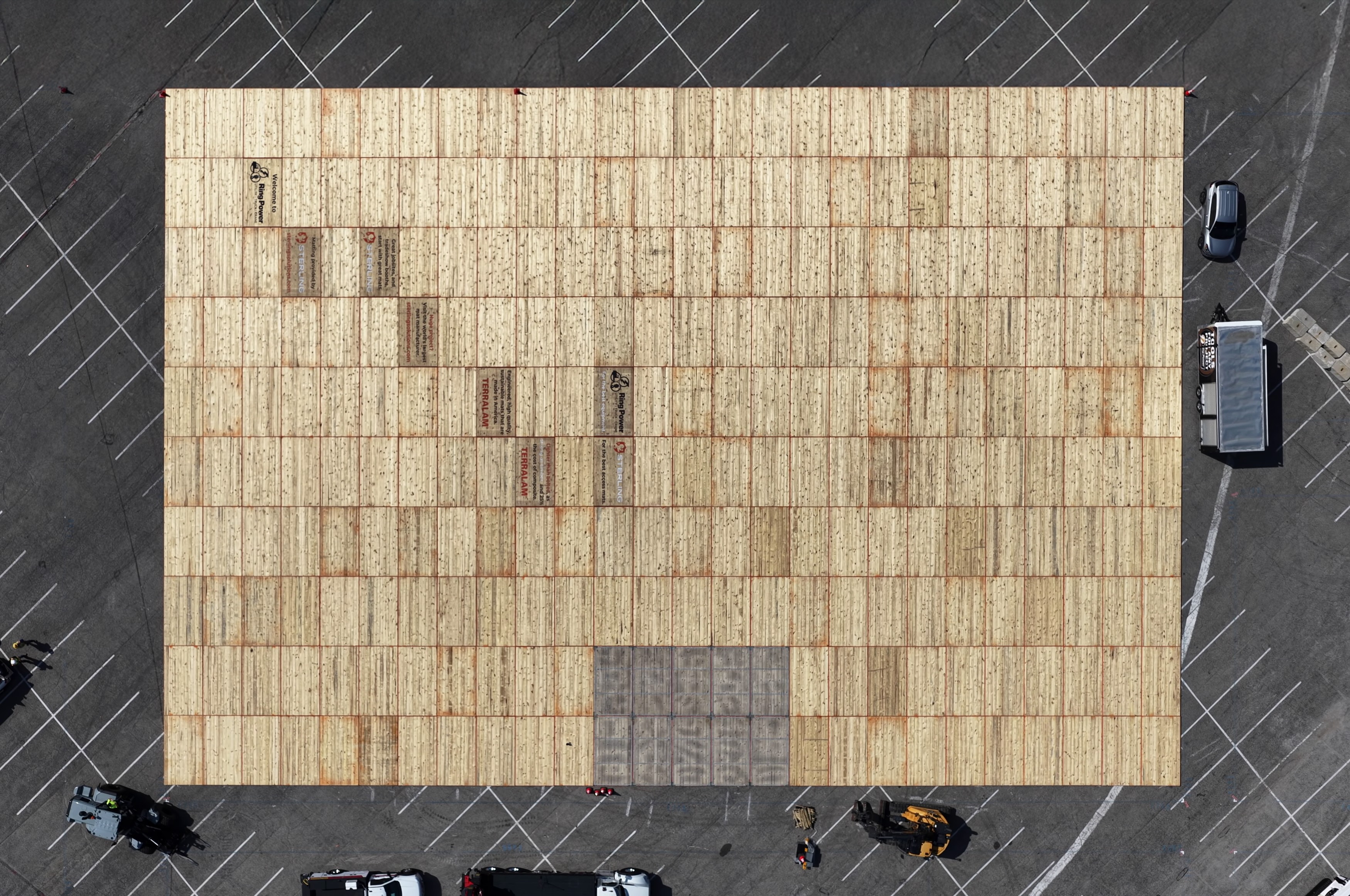 Sterling's TerraLam site access mats form the foundation for a heavy equipment display at the Utility Expo