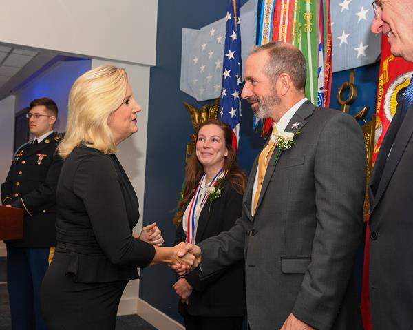 (U.S. Army photo by Sgt. David Resnick) Secretary of the Army presents Zachary and Elizabeth Fisher Distinguished Civilian Humanitarian Award