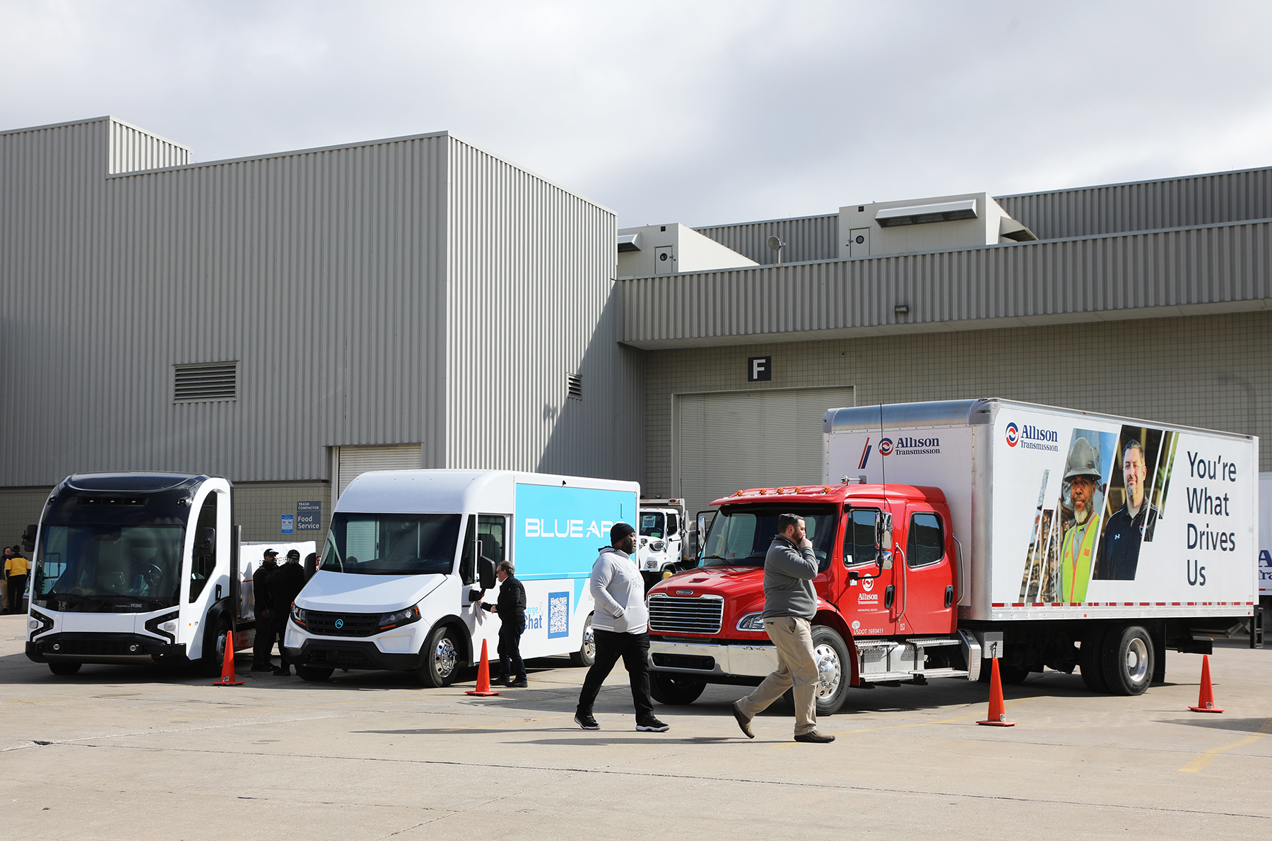 People walk around electric vehicles and trucks featuring the latest technology and sustainability options at Work Truck Week Ride & Drive