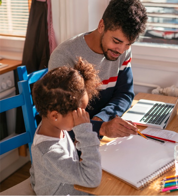 Father and daughter working on homework