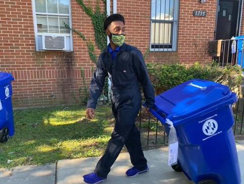 Baltimore City Mayor Brandon M. Scott delivers recycling carts in Baltimore today