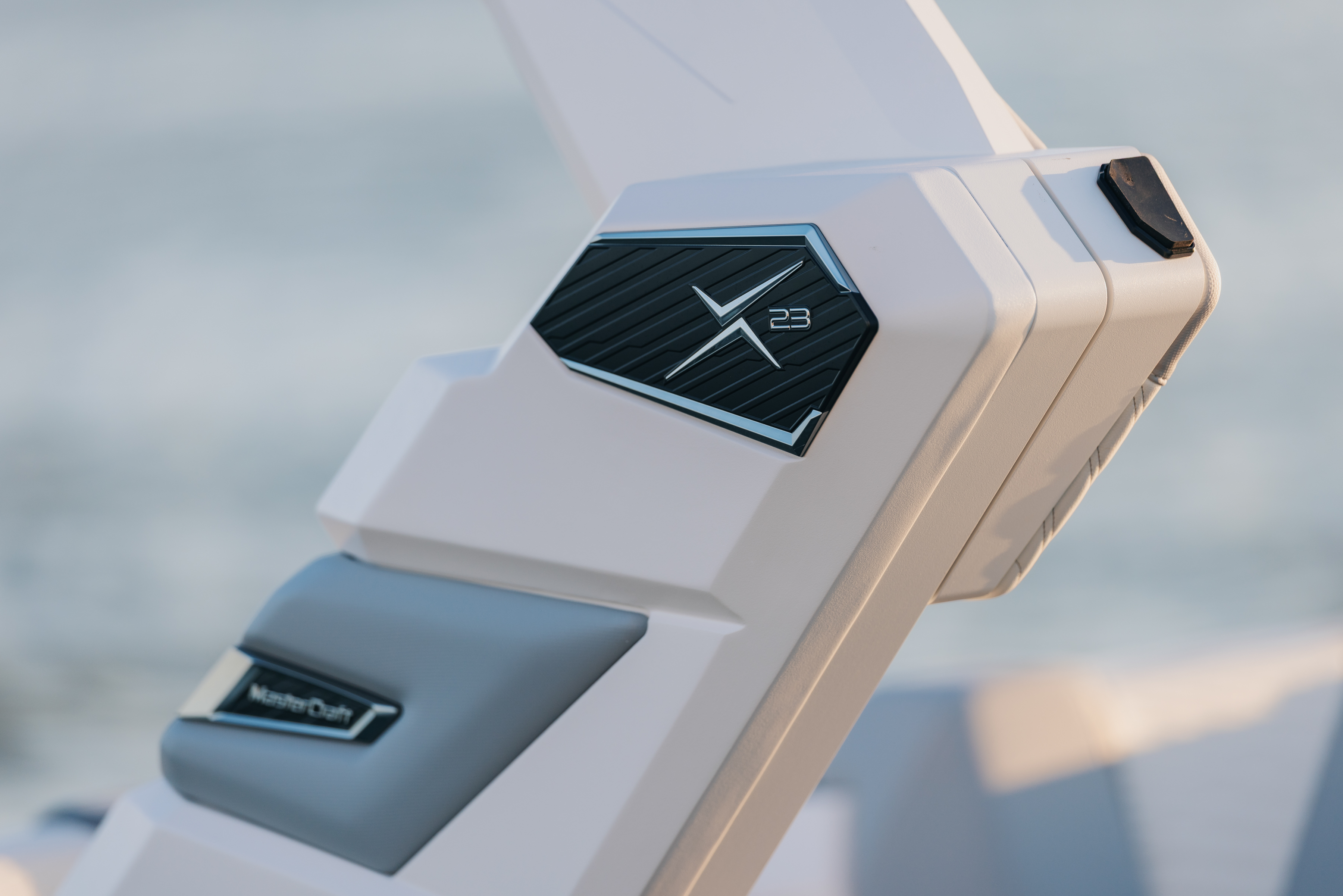 Close-up of the X23 badge integrated into the wake tower. 