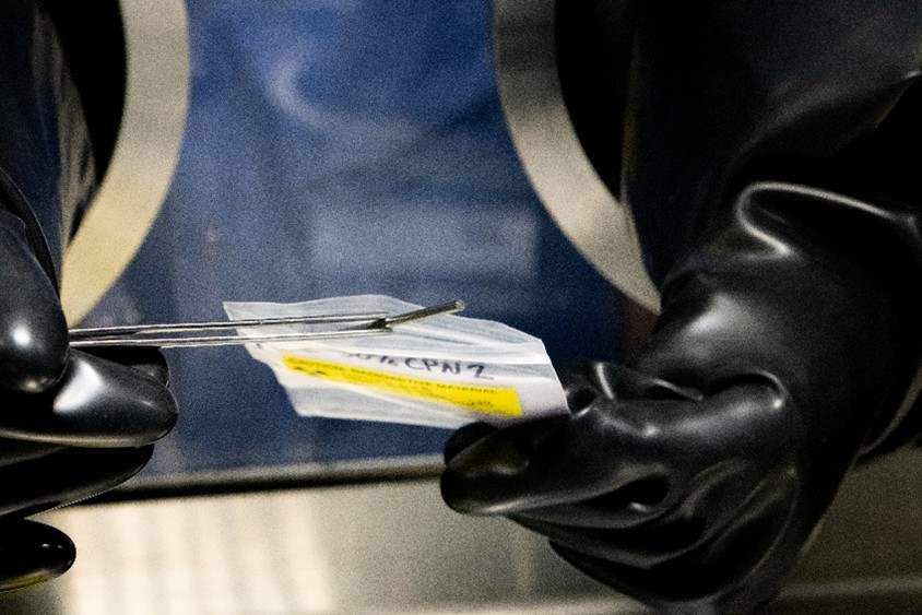 A close-up view of a finished enriched uranium-zirconium coupon sample