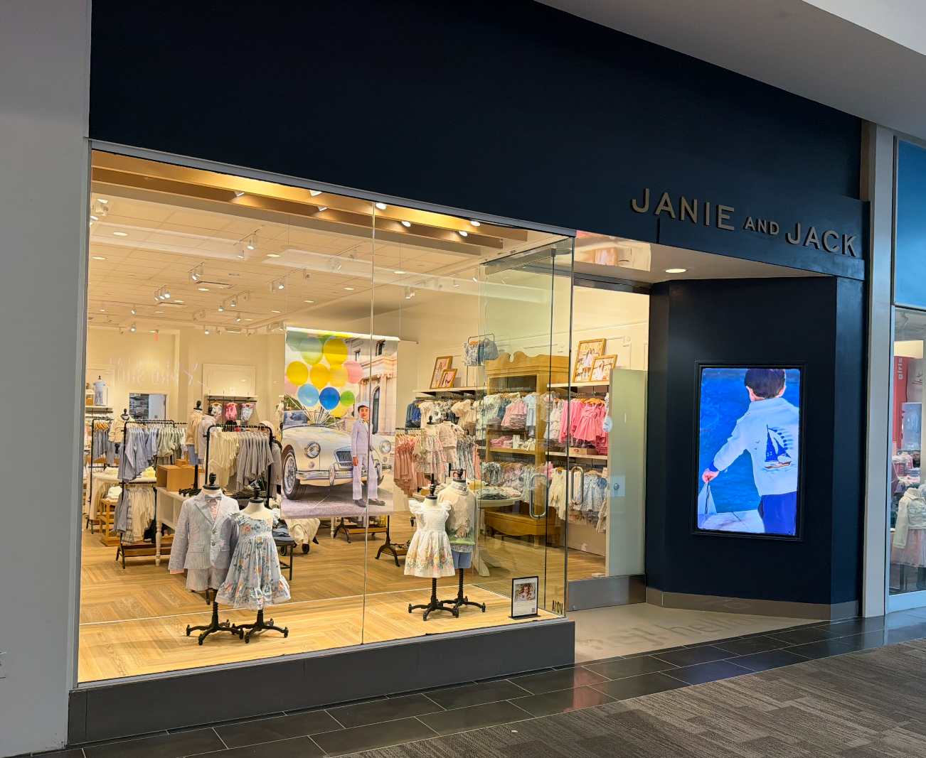 Janie and Jack mall storefront with Samsung 4K display