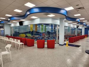This brand-new, state-of-the-art swim school features 14 swim zones, a wrap-around, glass-paneled viewing area and front row seats to your child's swim lessons in the signature cozy, red Aqua-Tots armchairs.