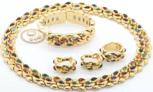 Chopard Casmir heavy 18k yellow gold rainbow gemstone formal set. Sold for $35,000 at last week’s SFLMaven Famous Thursday Night Auction