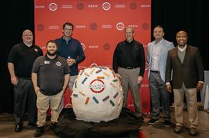 Scooter's Coffee is the new GUINNESS WORLD RECORDS title holder for the World's Largest Cake Ball. Achieving the World's Largest Cake Ball is part of the Scooter's Coffee 25th Birthday Celebration in 2023. Pictured here, from left, are: Craig Stevenson, Vice President, Manufacturing; Kevin Mosher, Senior Bakery Manager; Todd Graeve, Chief Executive Officer; Don Eckles, Co-Founder and Chairman; Nick Jarecke, Senior Vice President, Supply Chain; Joe Thornton, President.