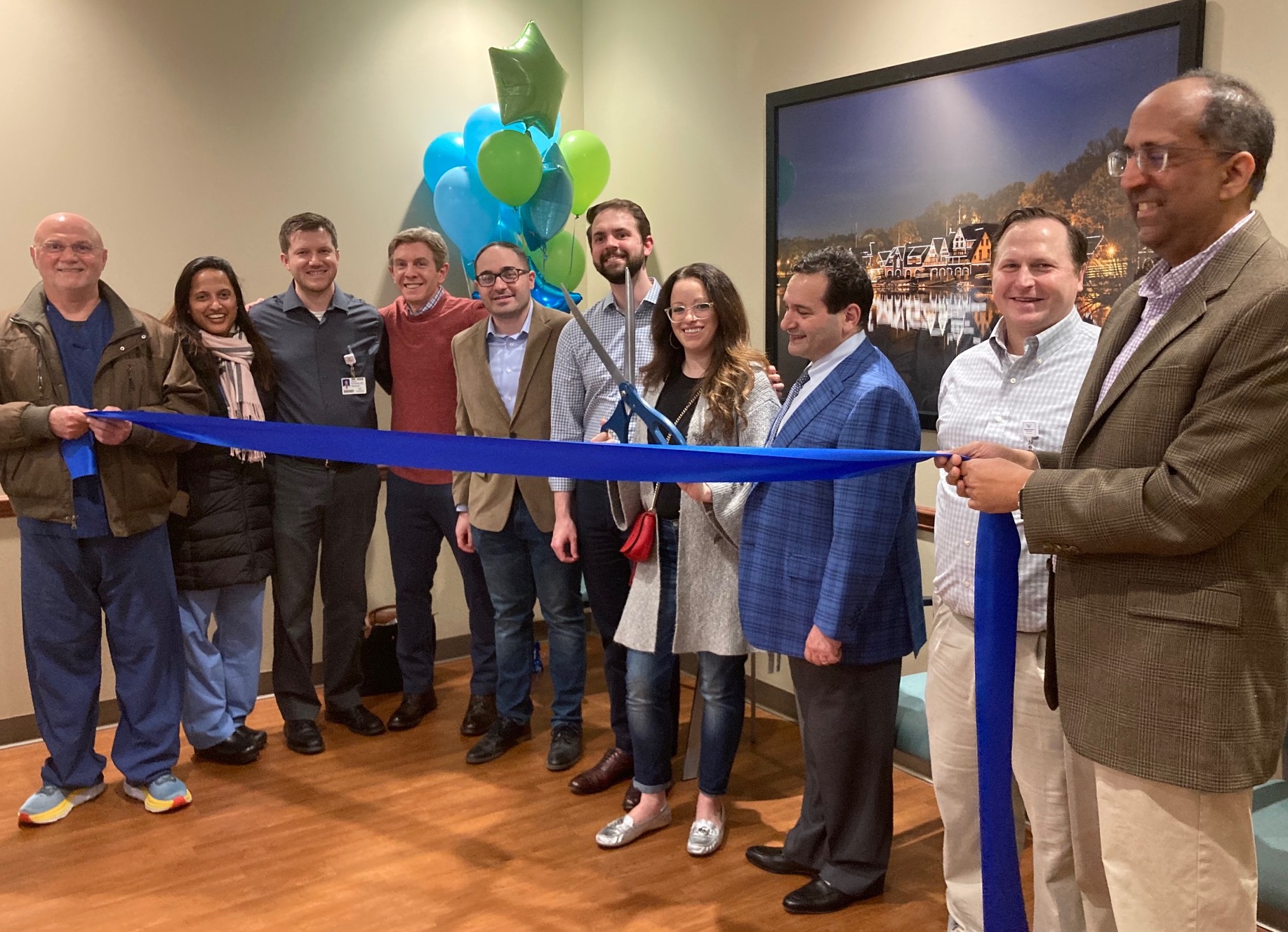 USDH staff members gather to perform a ribbon cutting ceremony at the newly relocated Broomall location.