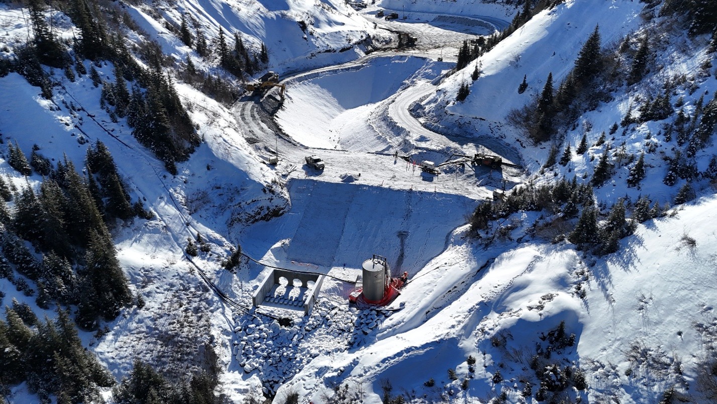 Sediment control pond spillway concrete work & dam raise.