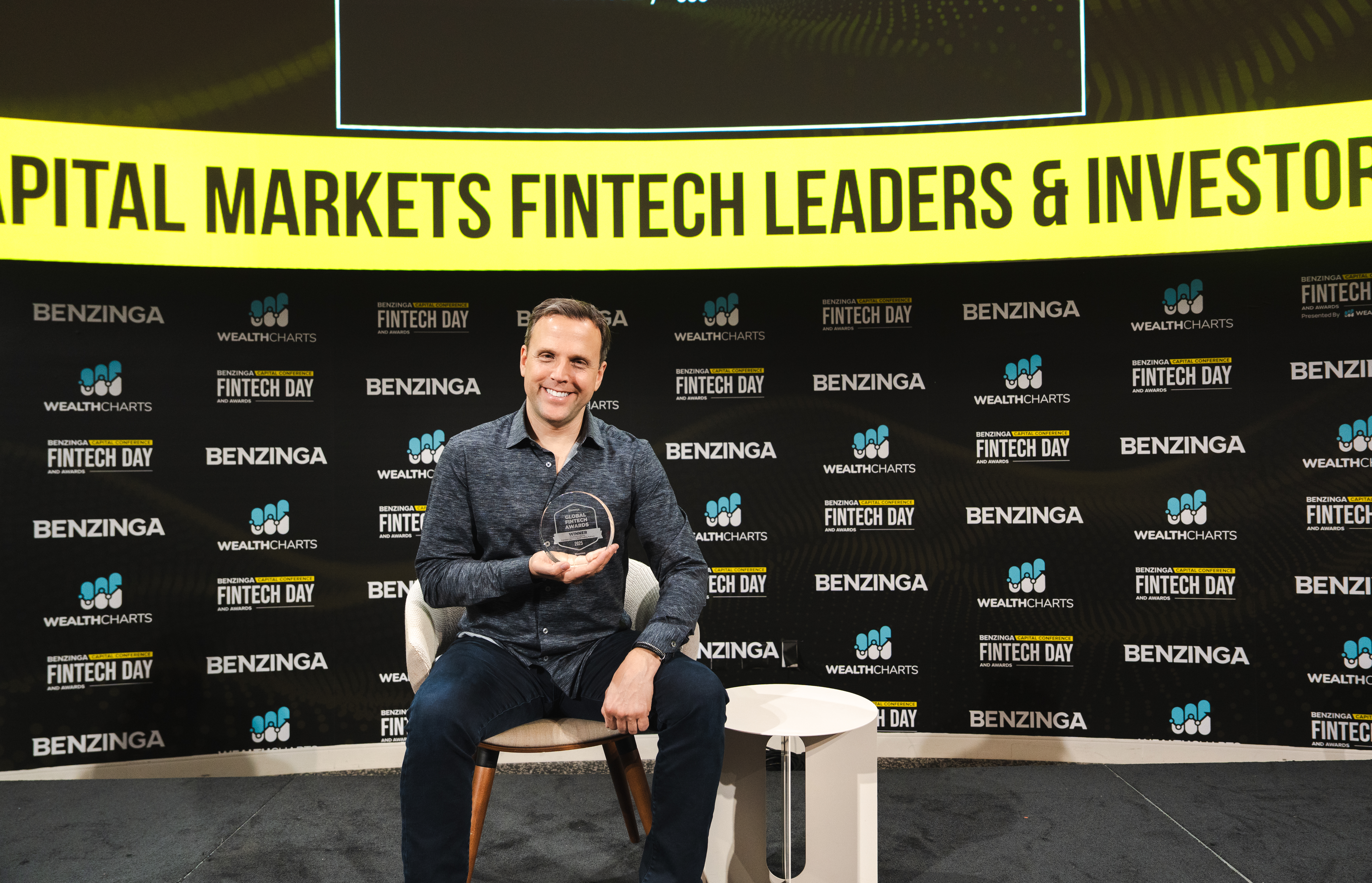 Micahel Arbus, CEO of Moomoo Financial Canada celebrates win after receiving Benzinga's Chairman Award for Canada's Best U.S. Stock Trading Platform.