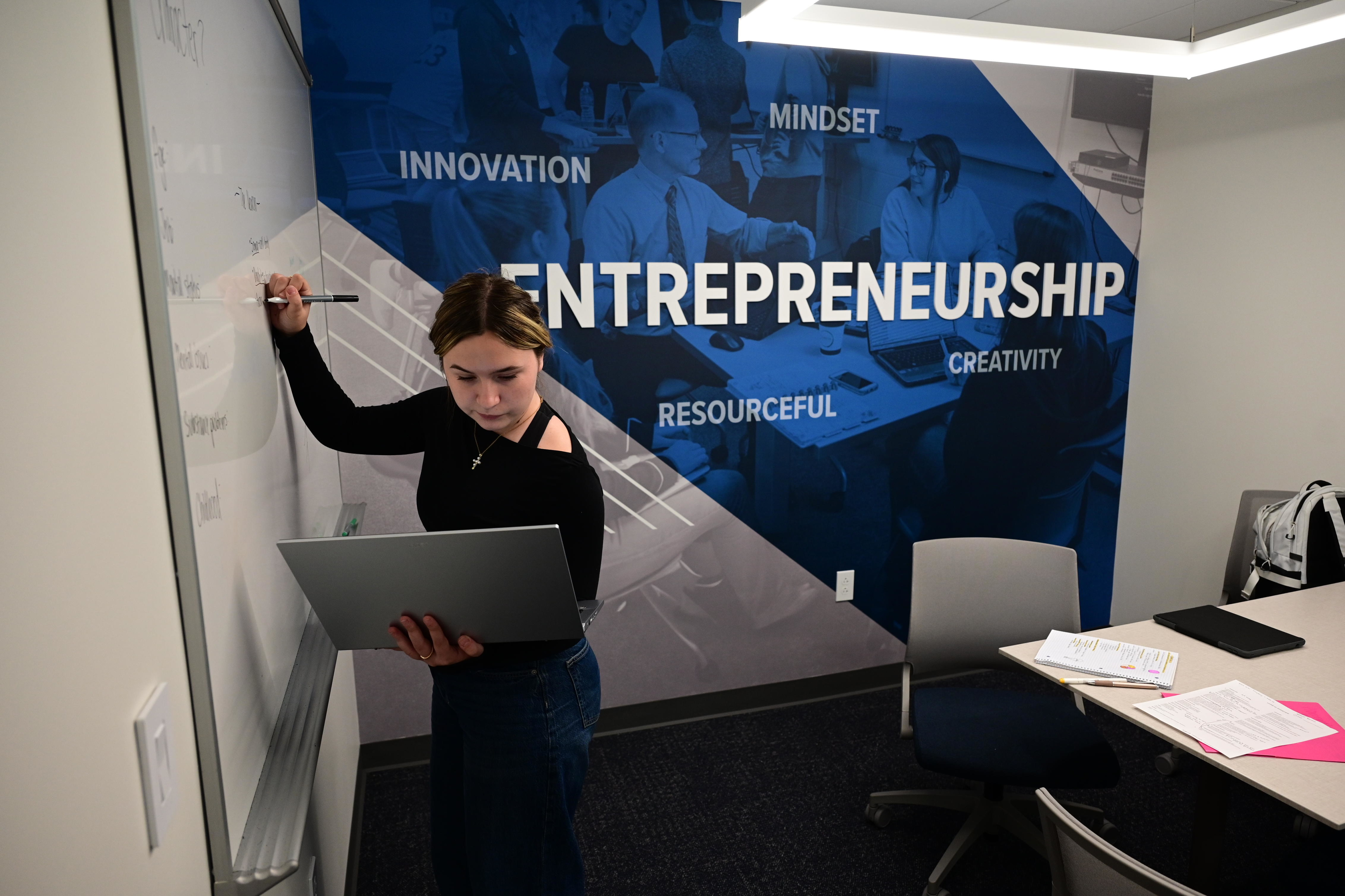 One of the fastest growing programs at Cedarville University is entrepreneurship. Here, a student drafts new project ideas inside the Scharnberg Business and Communication Center. Photo by Scott Huck