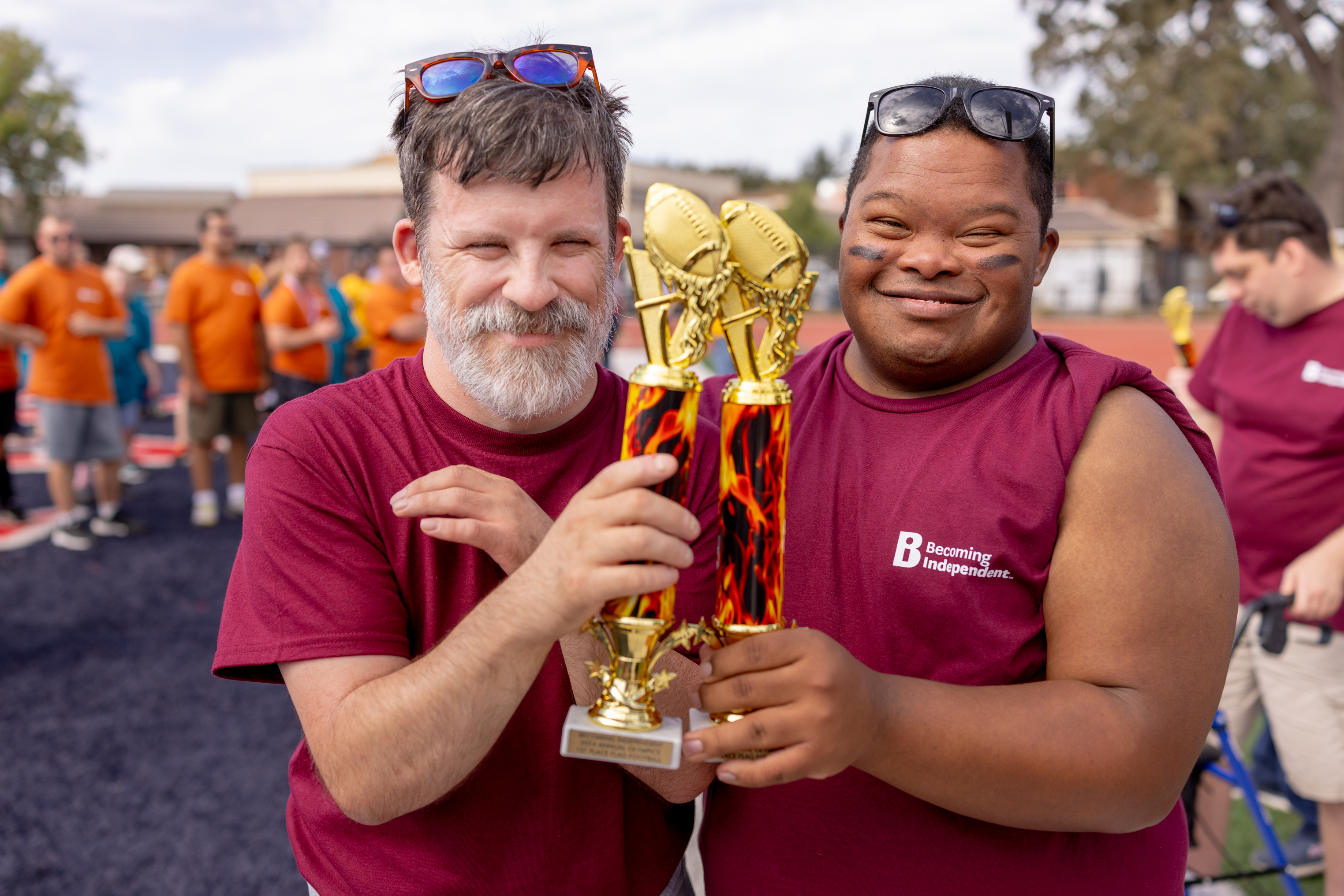 Flag football teammates celebrate with their trophies at the BI Olympics. Photo: Kelsey Floyd