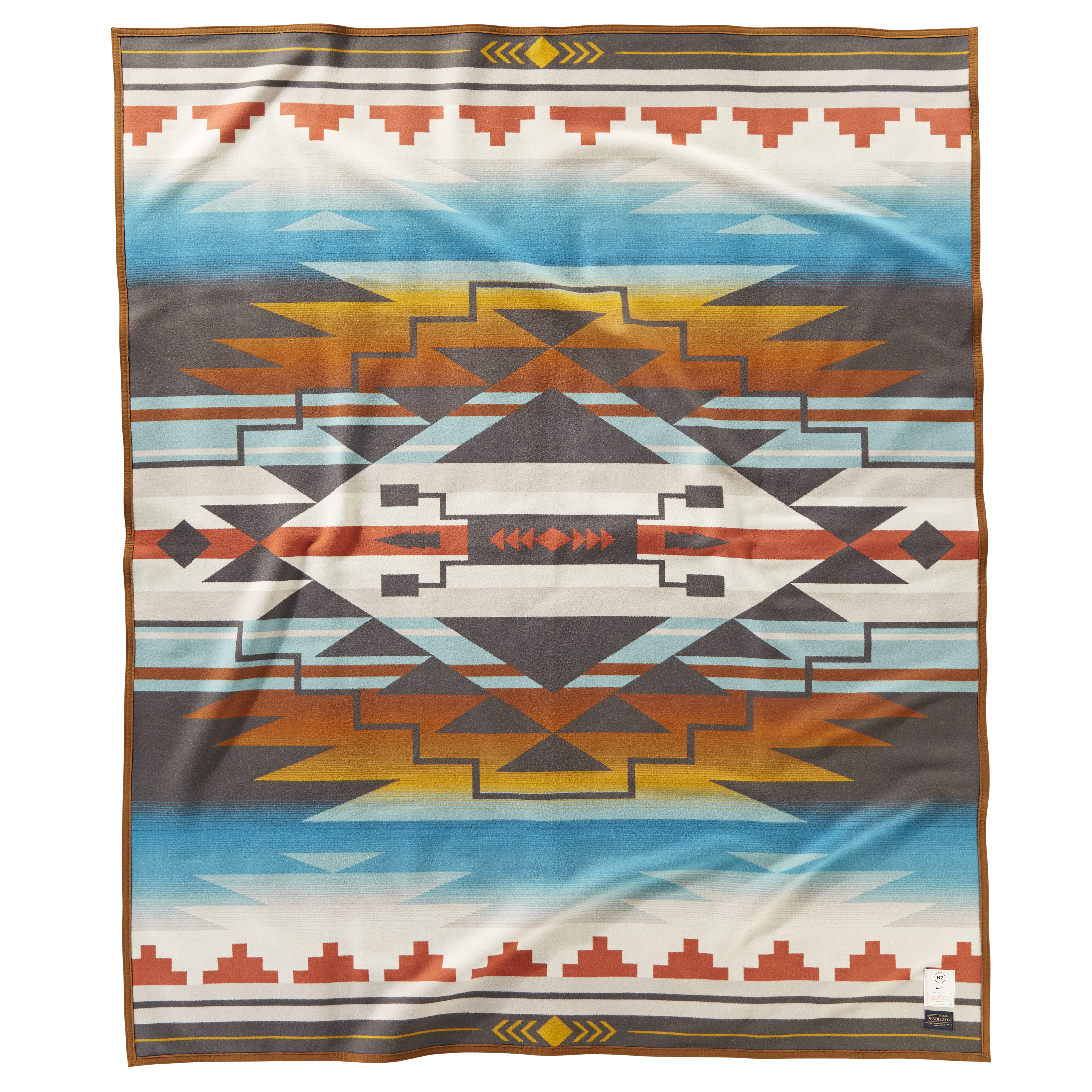 7 Generations blanket designed by Tracie Jackson (Dine’), a fourth-generation artisan from Star Mountain, in Navajo Country, AZ.  The Nike N7 design, 7 Generations, illustrates the past, present and future of the Navajo Nation. 