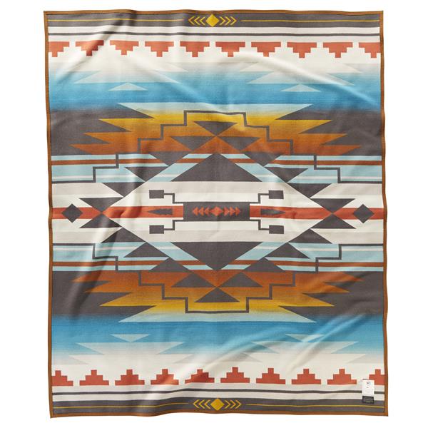 7 Generations blanket designed by Tracie Jackson (Dine’), a fourth-generation artisan from Star Mountain, in Navajo Country, AZ.  The Nike N7 design, 7 Generations, illustrates the past, present and future of the Navajo Nation. 
